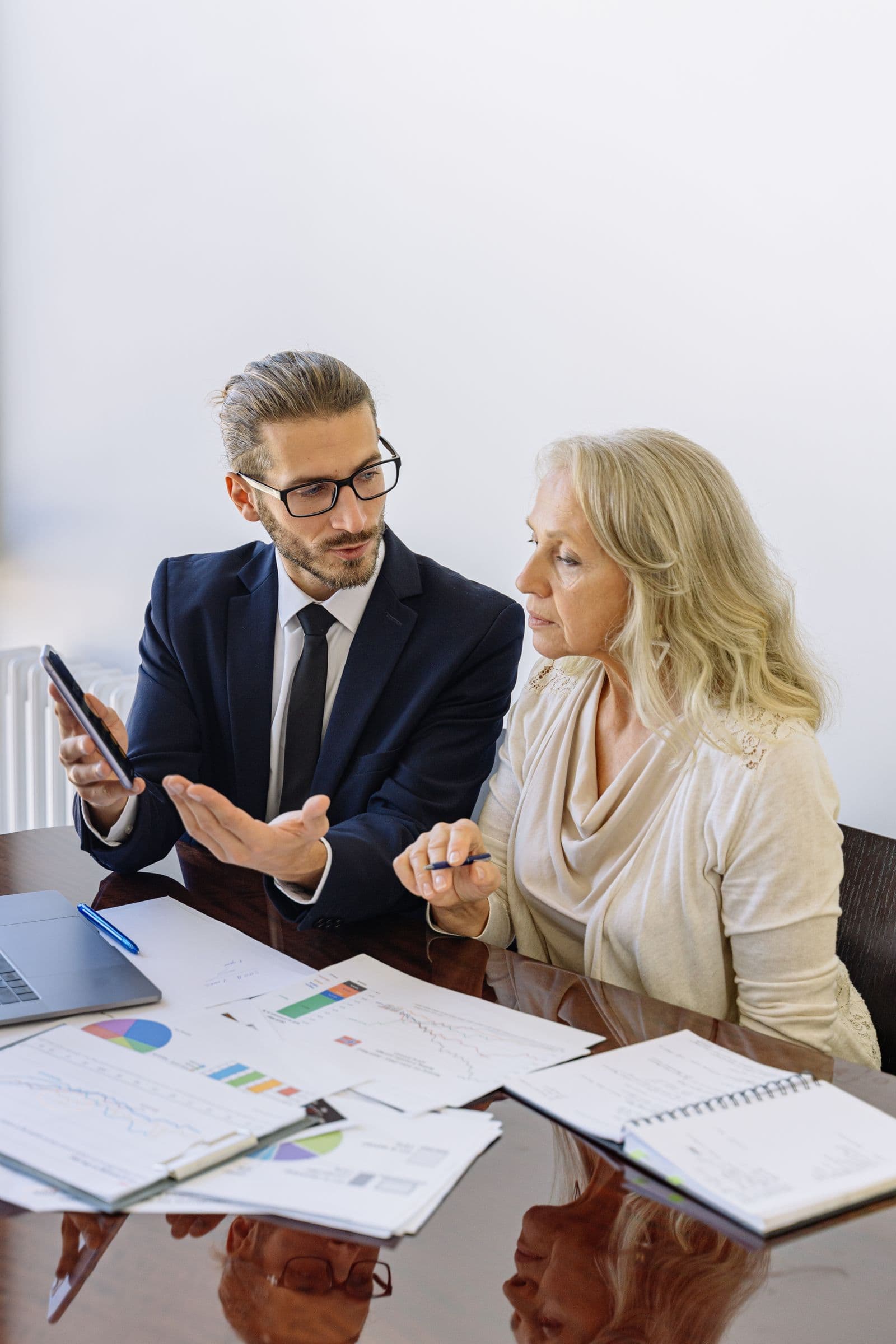 A couple planning their finances at a kitchen table